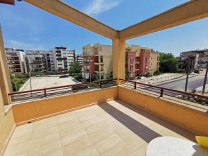 a balcony with a view of a city at Vila Gente in Mamaia Sat/Năvodari