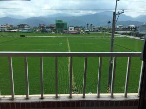 a view of a soccer field from a balcony at 羅東三好Sam-hao Homestay in Luodong