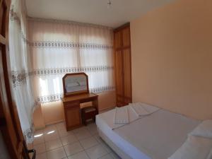 A bed or beds in a room at ÖZNUR APART OTEL