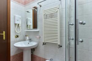 a bathroom with a sink and a shower at B&B Termini in Rome