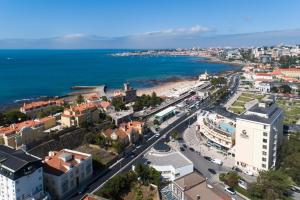 an aerial view of a city and the ocean at Vila Galé Estoril in Estoril