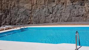 The swimming pool at or close to Dominos Apartment with heated pool by SunHousesCanarias