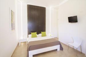 Ένα ή περισσότερα κρεβάτια σε δωμάτιο στο La Casina Di Borgagne