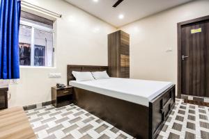 Postel nebo postele na pokoji v ubytování Hotel Vivek