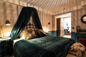 Säng eller sängar i ett rum på Näsby Slott