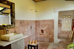 a bathroom with a sink and a shower at Coral View Villas in Amed +35 photos