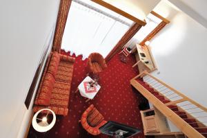 an overhead view of a room with stairs and red carpet at Landhotel Böld Oberammergau in Oberammergau