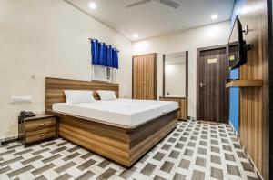 Postel nebo postele na pokoji v ubytování Hotel Vivek