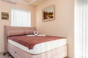 Postel nebo postele na pokoji v ubytování Villa Katarina