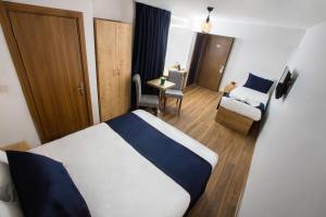 a hotel room with a bed and a chair at Golden Street Hotel in Istanbul