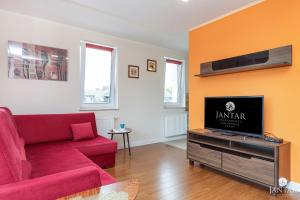 Telewizja i/lub zestaw kina domowego w obiekcie Wyspa Solna City Center by Jantar Apartamenty Kołobrzeg