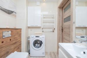 Łazienka w obiekcie Wyspa Solna City Center by Jantar Apartamenty Kołobrzeg