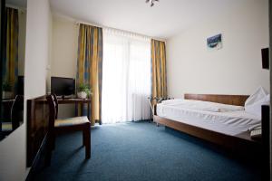 Postel nebo postele na pokoji v ubytování Hotel Lindenhof
