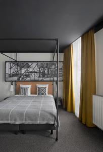 Postel nebo postele na pokoji v ubytování Zoom Hotel