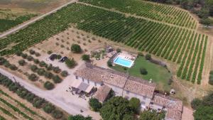 an aerial view of a estate with a pool in a field at Appartement St Victor in Puyvert
