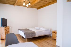 Łóżko lub łóżka w pokoju w obiekcie Willa u Bohuna Jacuzzi & Sauna