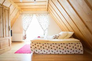 a bedroom with a bed in a attic at Willa u Bohuna in Zakopane