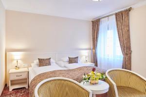 Postel nebo postele na pokoji v ubytování Spa Hotel Centrum