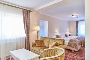 Postel nebo postele na pokoji v ubytování Spa Hotel Centrum