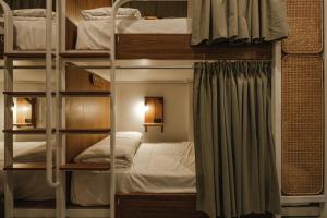 Ein Bett oder Betten in einem Zimmer der Unterkunft Hidden Garden Hostel