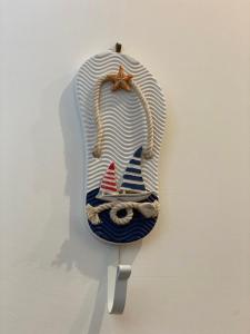 a glass ornament with a sailboat on a wall at Acquamarina Accommodation in Massa Lubrense