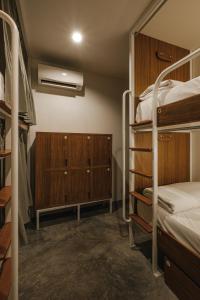 Ein Bett oder Betten in einem Zimmer der Unterkunft Hidden Garden Hostel