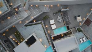 an overhead view of a building with a pool at Melidonia Suites in Akrotiri