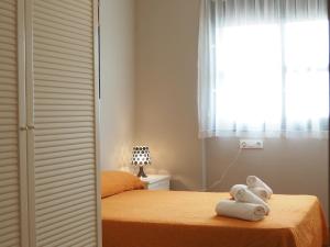 Postel nebo postele na pokoji v ubytování NINFA Apartamento con balcón ideal familias con vistas al mar