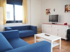 TV a/nebo společenská místnost v ubytování NINFA Apartamento con balcón ideal familias con vistas al mar