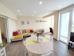 a living room with a table and a couch at By the CATHEDRAL · TOP center · 2 Bedroom FLAT in Varna City