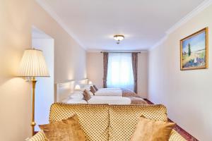 Postel nebo postele na pokoji v ubytování Spa Hotel Centrum
