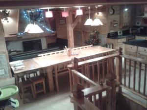 a large kitchen with a large wooden island in it at Chalet la scie in Samoëns