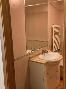 a bathroom with a sink and a mirror at Estudio Parking Centro Puerta del Sol in Vigo +38 photos