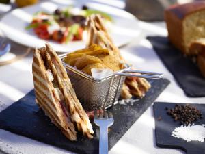 a plate of food on a table with a plate of bread at Melidonia Suites in Akrotiri