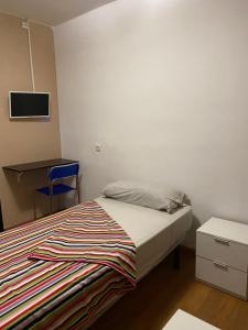 Cama o camas de una habitación en hostal urpi-oklahoma