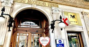 a building with a heart sign in front of a door at Best Western Hotel Moderno Verdi in Genova