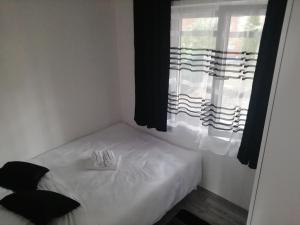 Voodi või voodid majutusasutuse Fenix apartman Vinci toas