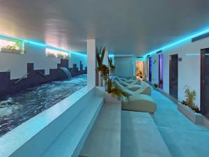 a living room with a swimming pool in a house at Hotel Villa Chiara in Terracina