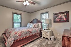 a bedroom with a bed and a ceiling fan at Lake Charles Home 1 Mi to Public Boat Launch in Lake Charles