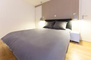 מיטה או מיטות בחדר ב-Le Faubourg - Apt 3étoiles, Centre Ville, Calme, Spacieux