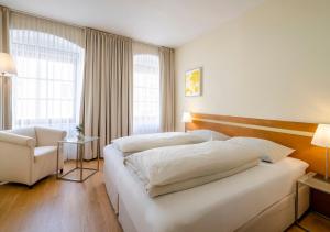 Katil atau katil-katil dalam bilik di Boutique Hotel Hauser