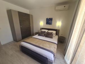 a bedroom with a large bed with two pillows at Private Apartment in Star Dreams Complex in Sveti Vlas +53 photos