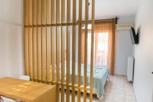 Postel nebo postele na pokoji v ubytování Vasilis Apartments