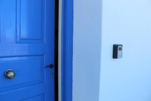 a blue door with a door knob on it at Cycladic Villa in Amorgos Island (Maison Shiro) in Arkesíni
