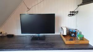 TV a/nebo společenská místnost v ubytování Guesthouse Zandvoort
