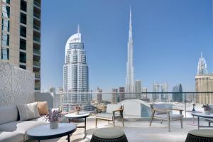 a large building with a lot of windows on top of it at Address Fountain Views in Dubai