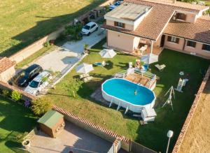 an aerial view of a house with a swimming pool at Villa Elegance in Ladispoli