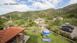 an aerial view of a yard with a car and a house at A & B Holiday Home in Deiva Marina