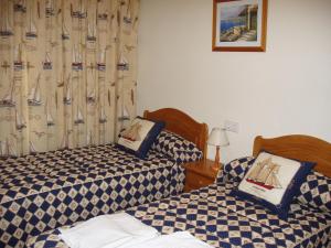 Postel nebo postele na pokoji v ubytování Apartamentos Pueblo Salado