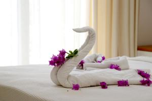 Ένα ή περισσότερα κρεβάτια σε δωμάτιο στο Odyssey Residence Apartments
